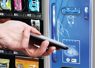 Snack vending machine accepts contactless payments, e-wallet payments, credit cards, debit cards, bills and coins.